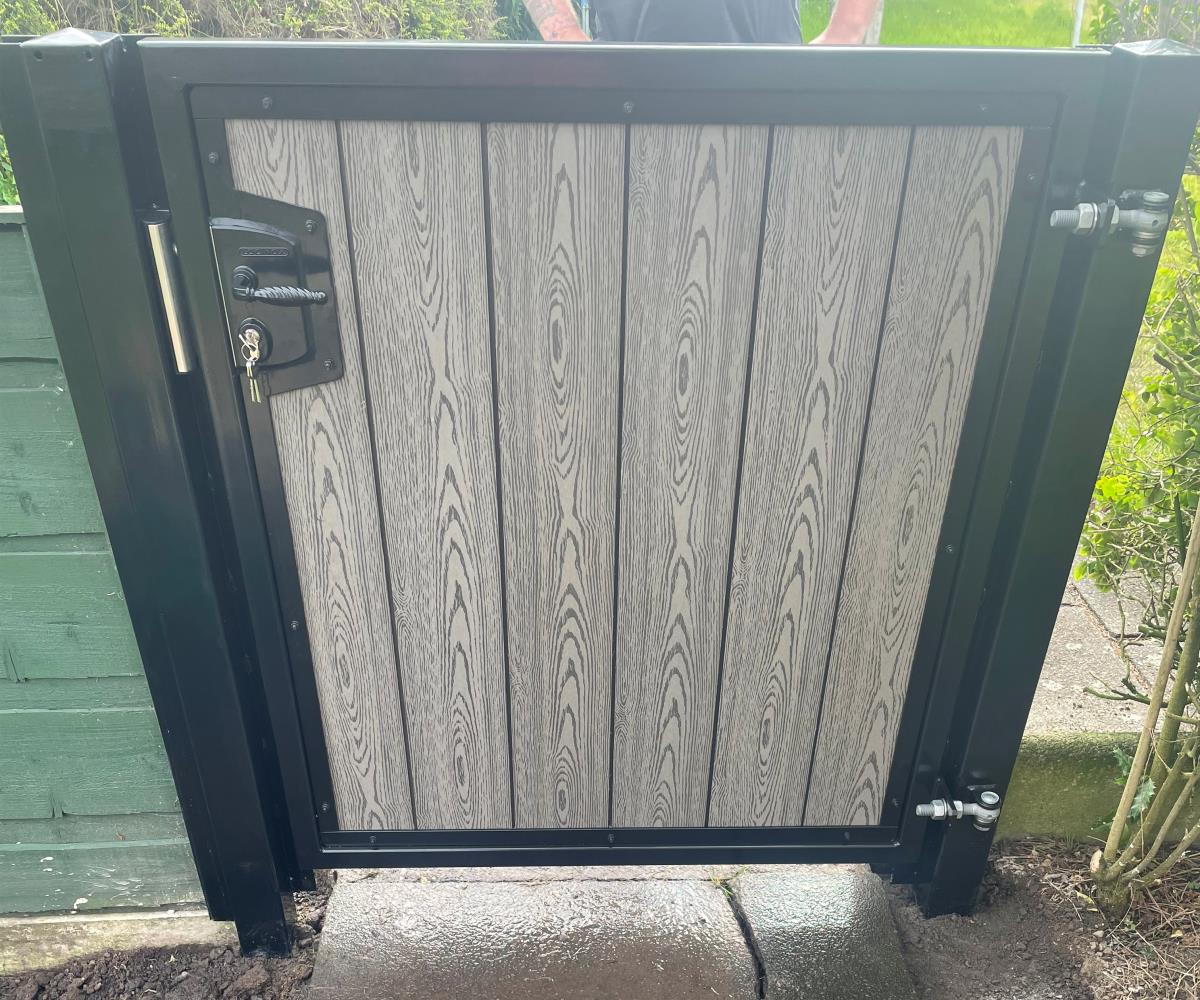 Bespoke steel framed composite gate in ash grey wood grain effect for a home in Lowton, Wigan.