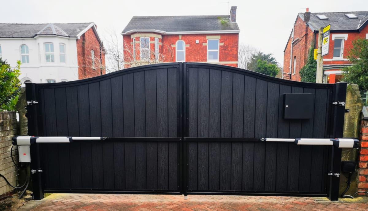 Automated electric composite gates in black with arch top installed to a home in Merseyside.