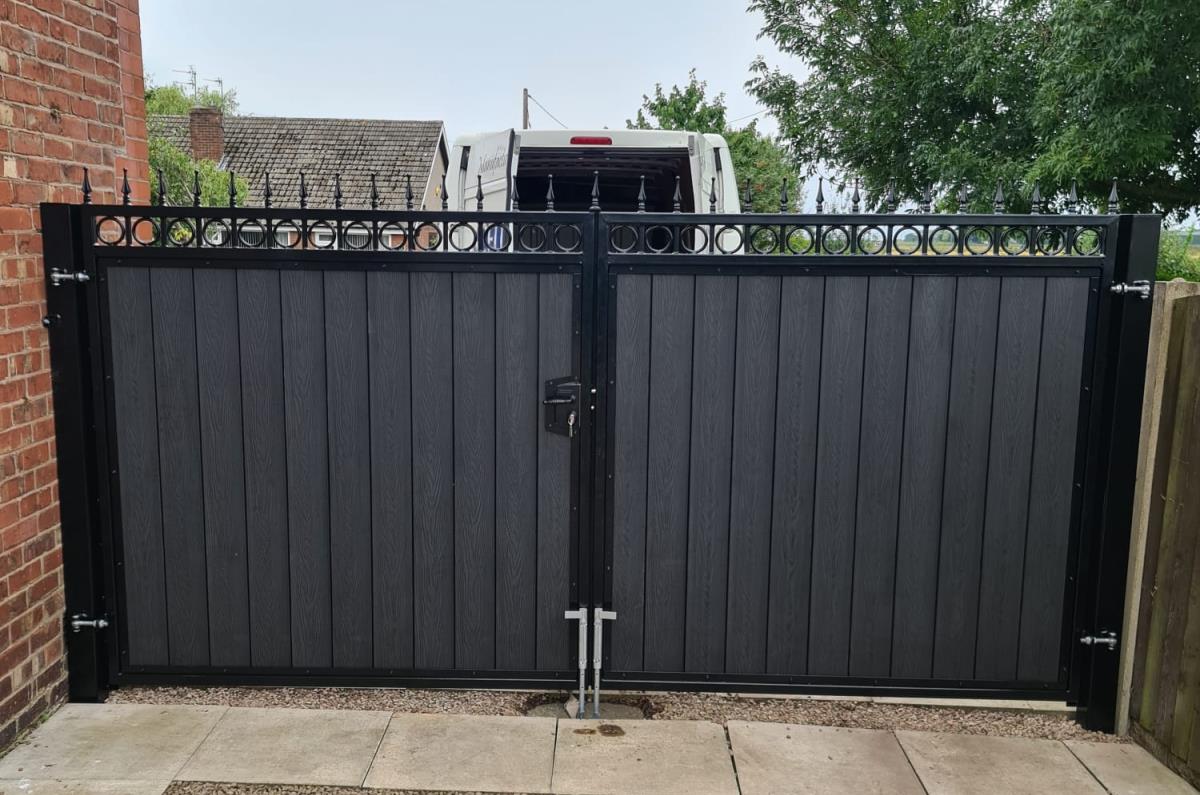 Ornate steel gates with embossed composite infill installed in Hesketh Bank, Lancashire.