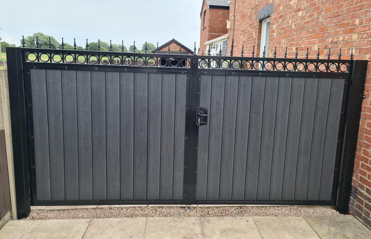 Ornate steel gates with black embossed composite infill fitted in Hesketh Bank, Southport.