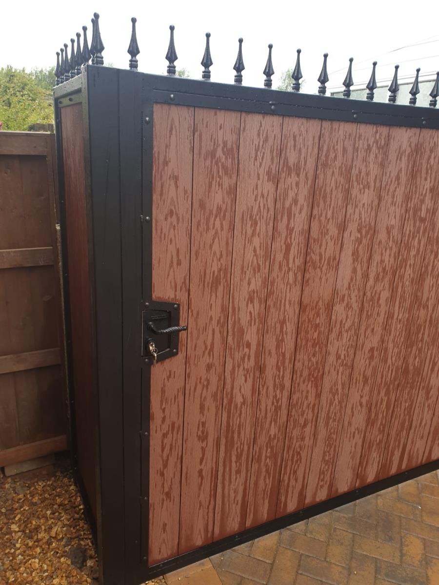 Composite gate and panel fitted in the driveway of a Leyland property.