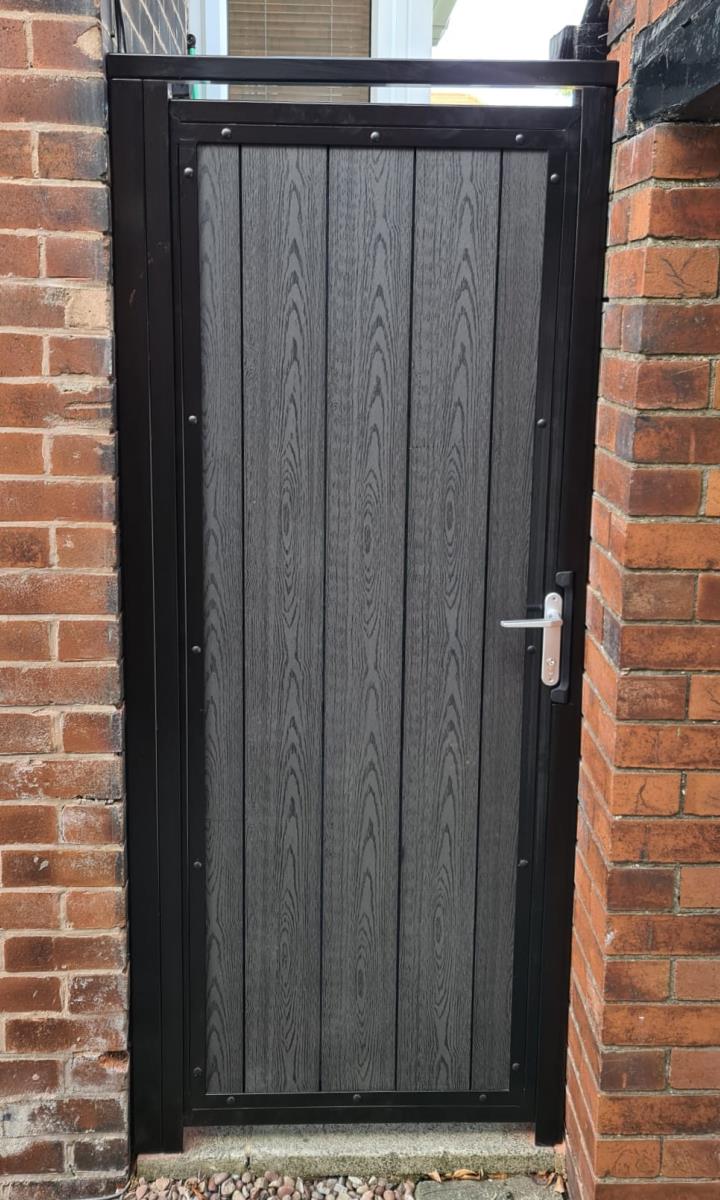 Composite side gate with wood effect infill installed in Wigan, Greater Manchester.