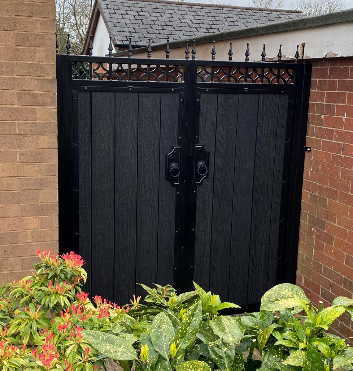 Black embossed composite gates in an ornate frame fitted for a customer in Macclesfield.