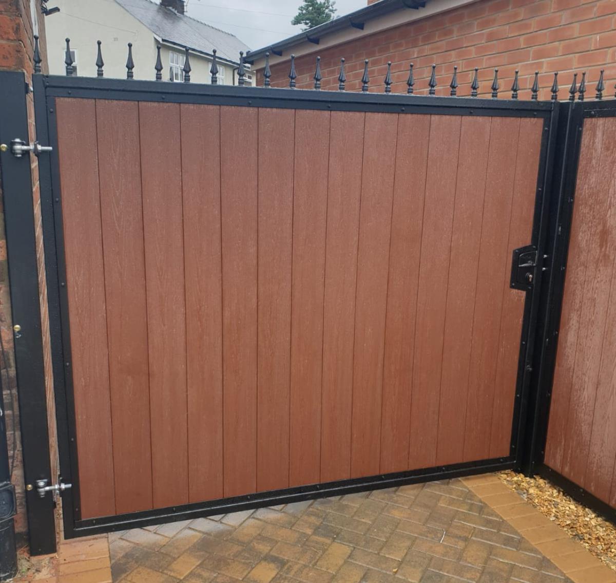 Composite gate fitted in the Lancaster area with wood effect infill and a matching side panel.