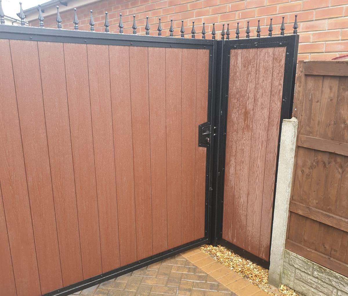 Composite gate in wood effect infill colouring with matching side panel fitted in Chorley area.