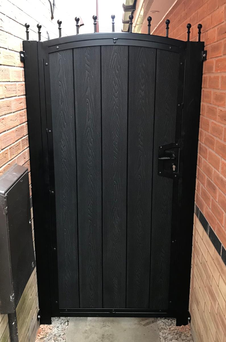 Composite gate with black timber effect infill fitted to the alley of home in the Altrincham area.