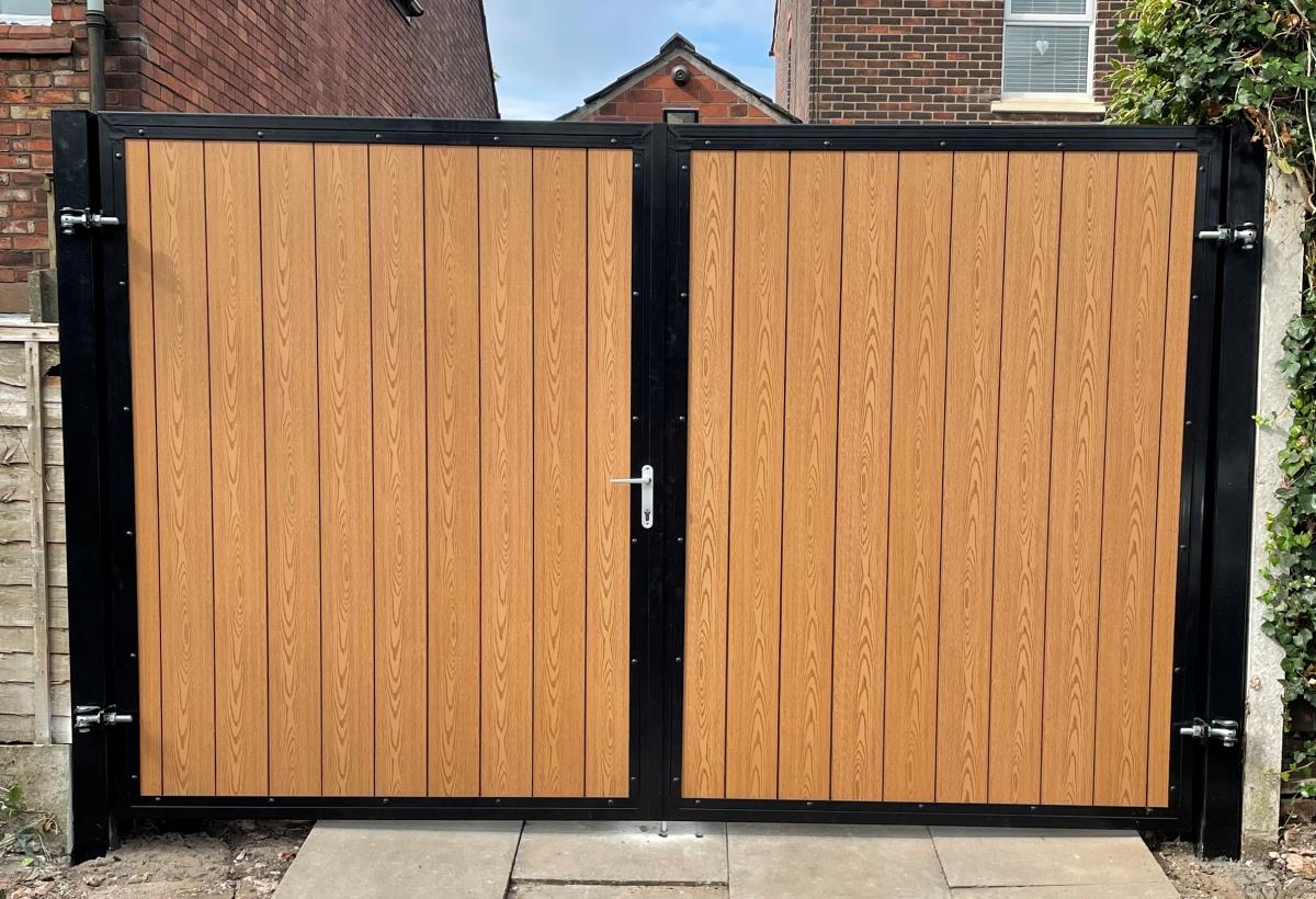 Arched composite gate with embossed timber infill fitted to alley of property in the Bolton area.