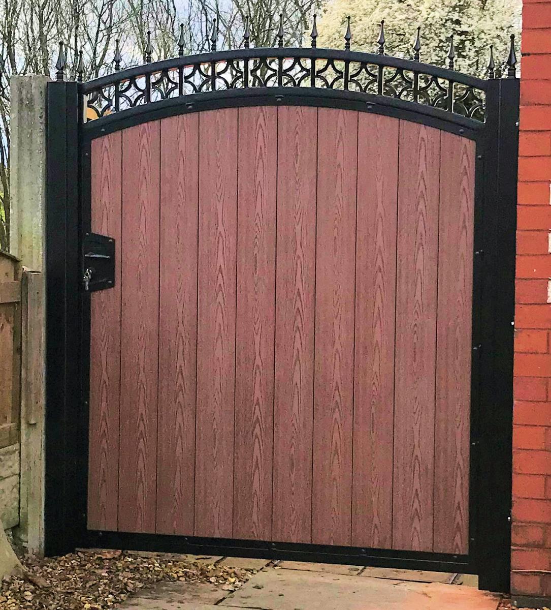 Ornate composite gate in timber effect with integral locking built in fitted in the Wigan area.
