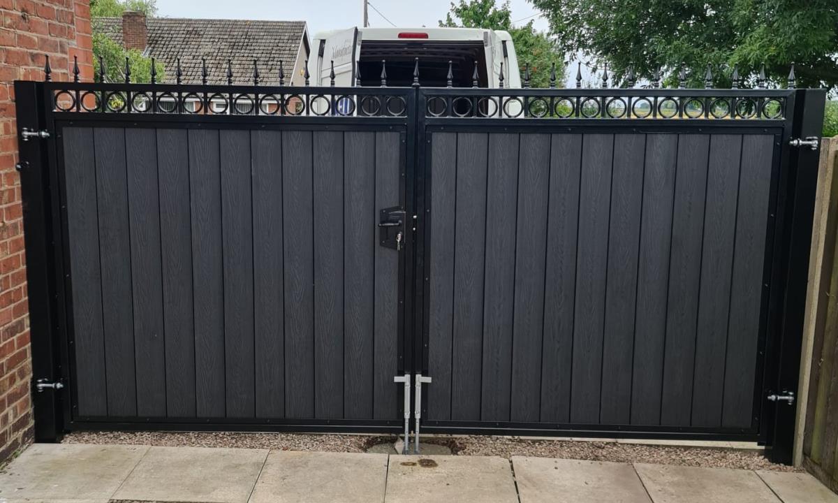 One and two thirds double composite gates in golden oak style fitted at a property in the St Helens area.