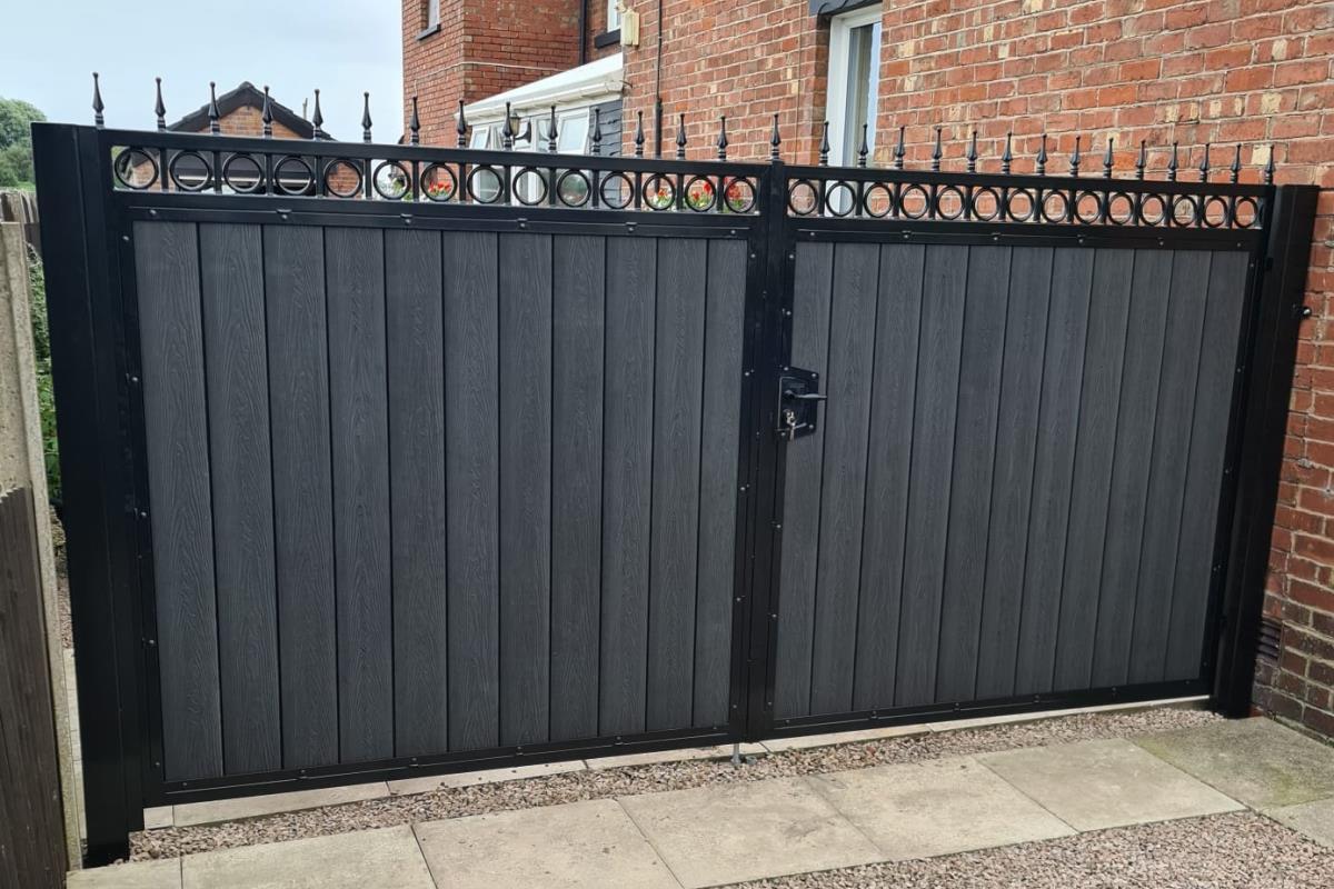 One and two thirds double composite gates in golden oak style fitted at a property in the Liverpool area.