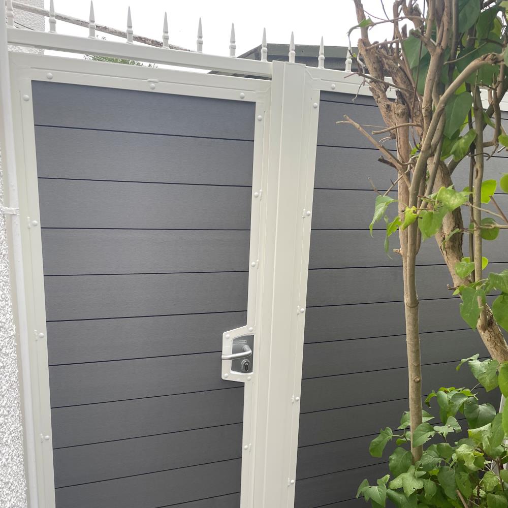 Another angle of an attractive composite gate in a white powder coated steel frame in West Kirby.