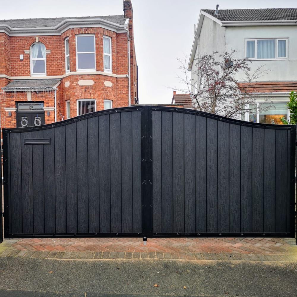 Arch top black embossed composite electric gates fitted for a customer in Southport.